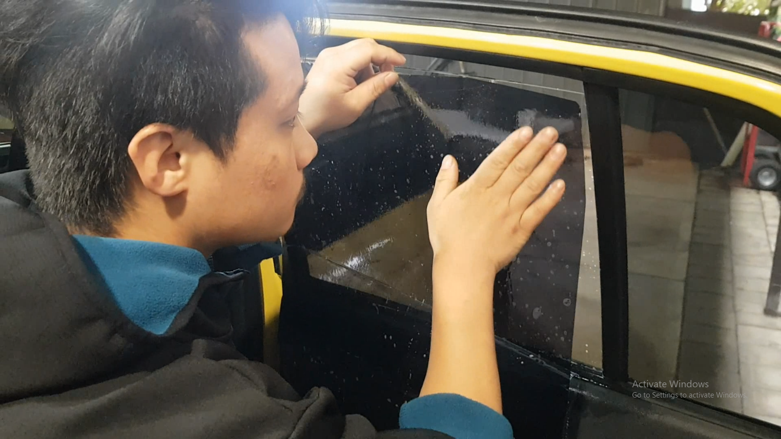 Bikash Bhandari — tinting a car professionally