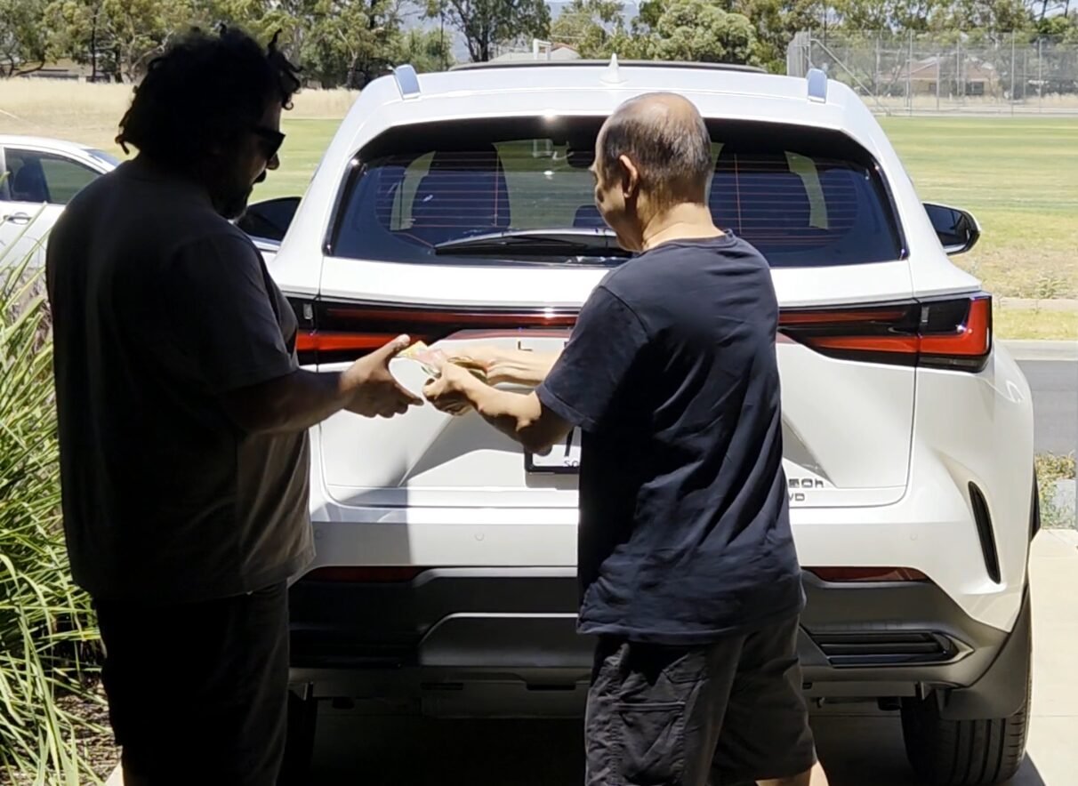 Customer paying for window tinting at home