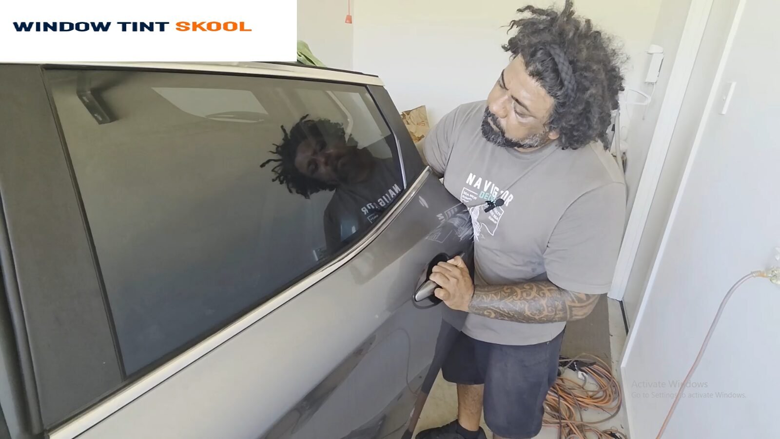 Alex Harry tinting a car from his home garage in Adelaide