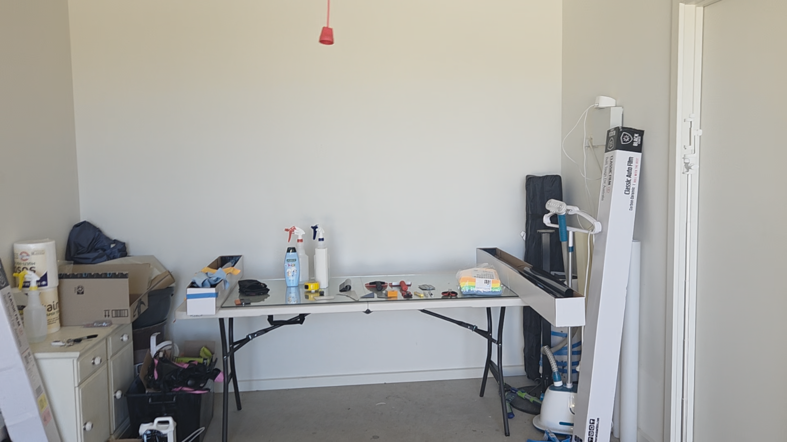 Home garage window tinting setup — professional workspace